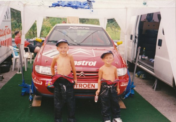 Me and my brother in front of our father's race car in 1999